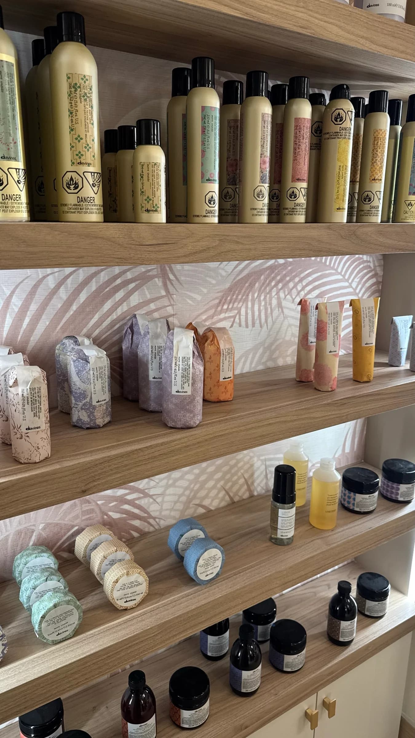 Close view of professional haircare and styling products on Salon Capelli's shelves